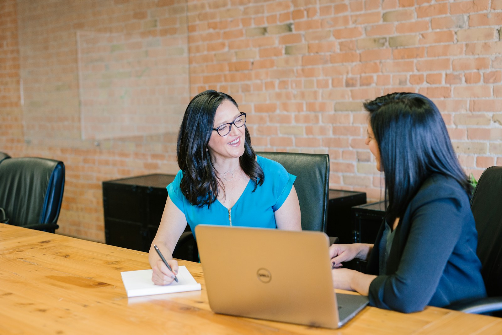 Two professionals having a friendly workplace meeting